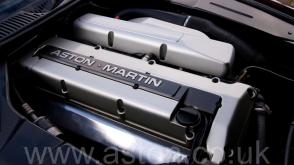 на дороге Астон Мартин Aston Martin DB7 Coupe 1996. Кликните для просмотра фото автомобиля большего размера.